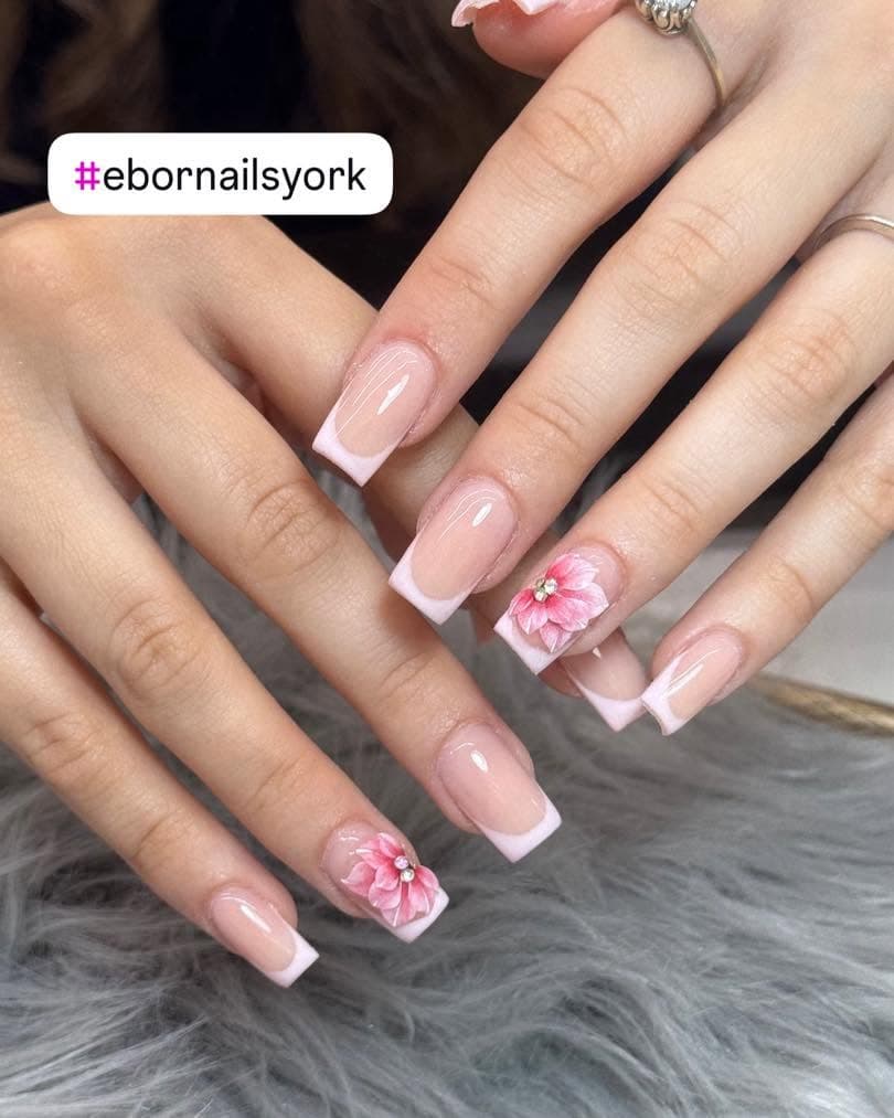 Square pink French tips with a 3D flower accent nail