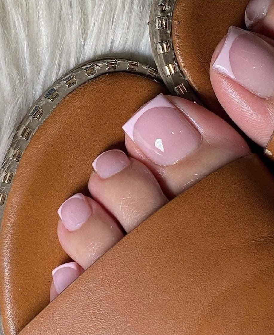 Pink French tip pedicure on square toenails